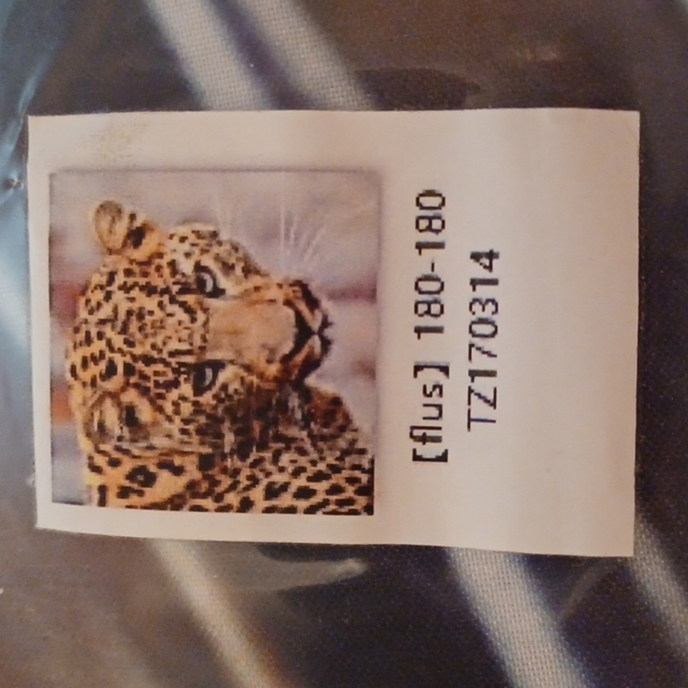 Shower curtain with leopard face. Never opened.